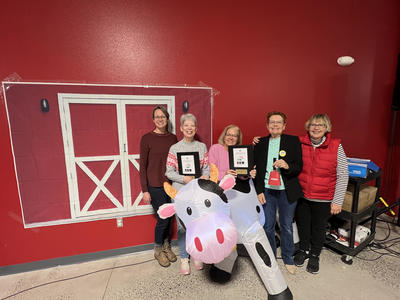 Library volunteers with their COW Awards